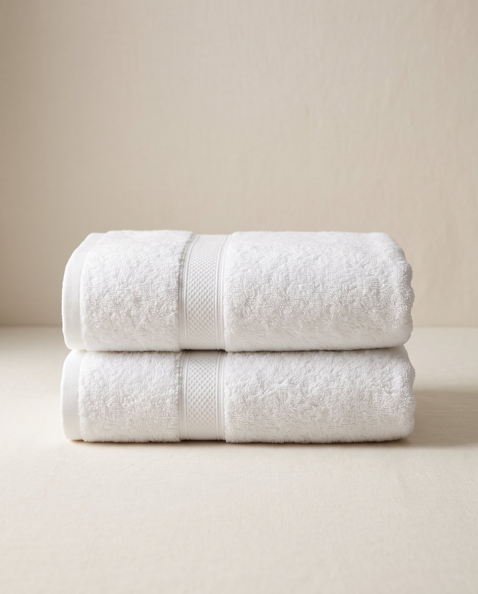 Folded white hotel bath towels